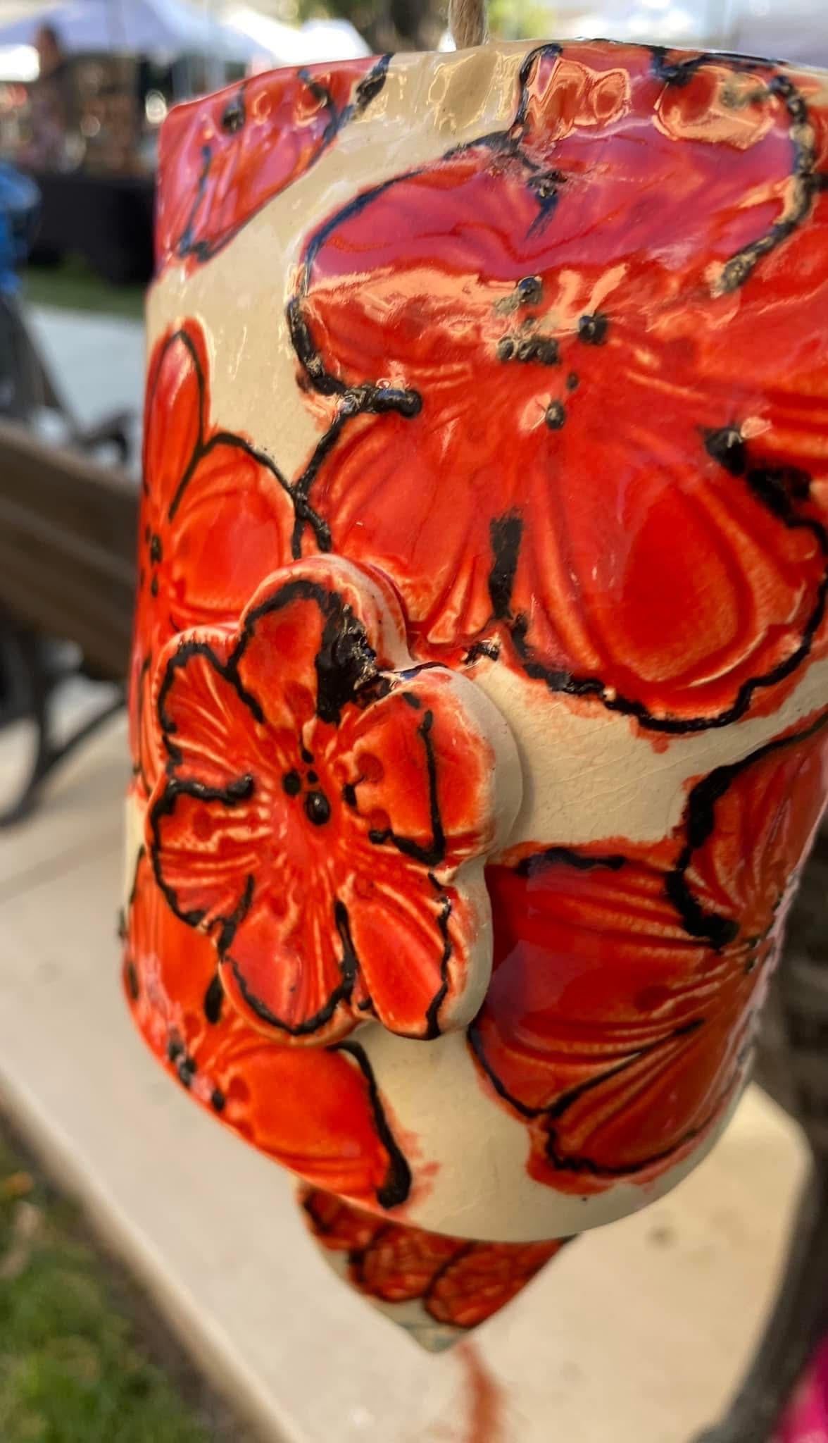 Red floral ceramic bell